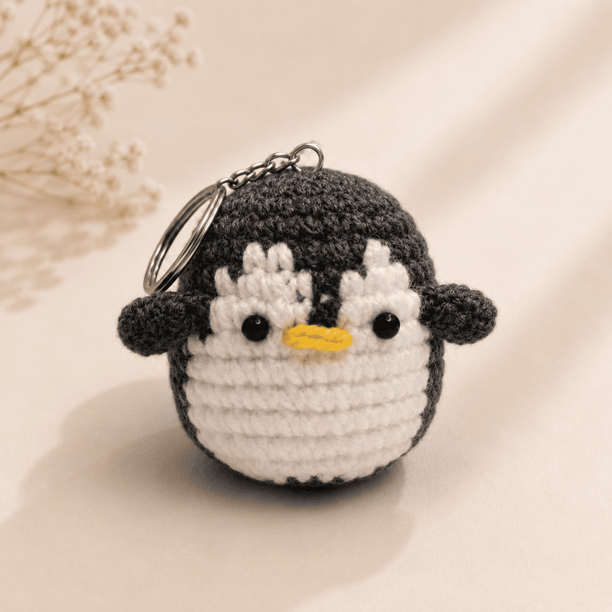 Grey Penguin Crochet Charm Keychain - Image 1